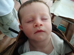 newborn sleep ing in the carrier